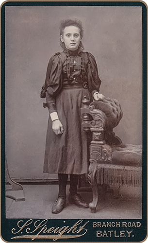 Restored cabinet photo of a young lady by the studio of Speight, Batley, England.